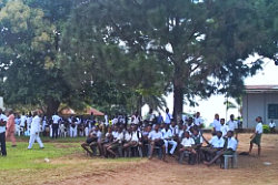 a team of volunteers showing unity, putting their hands together at the center